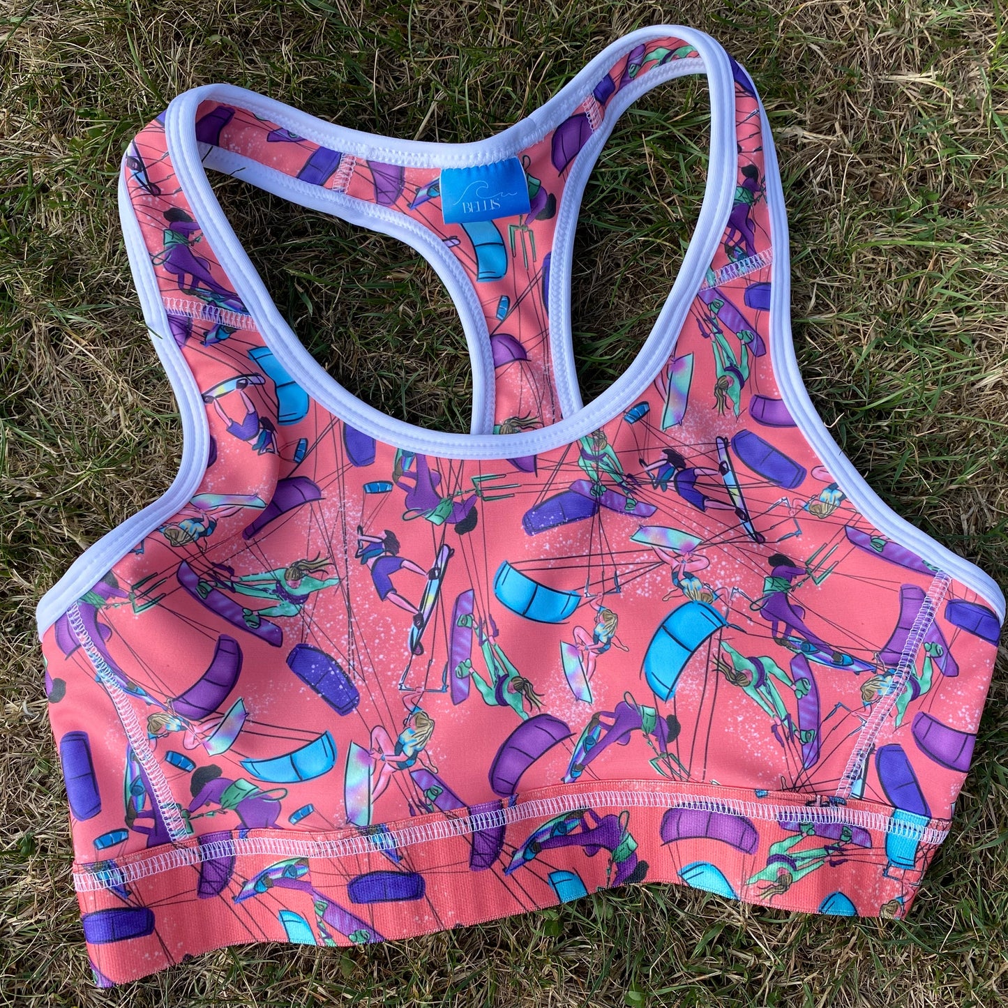 Orange sports bra on grass