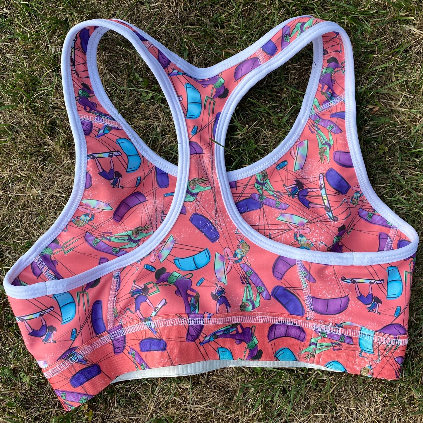 Orange sports bra on hanger